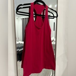 Lululemon Tank. Lightly Used in good condition. No piling w one tiny spot/stain